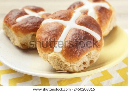 Tasty hot cross buns on table, closeup