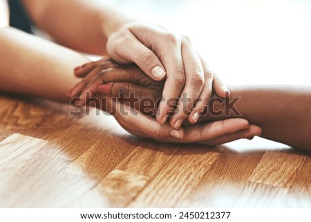 Empathy, people and holding hands for support, help and comfort during grief, mourning and care for healing. Trust, friends and embrace for loss, mental health and to show love for hope or assurance Royalty-Free Stock Photo #2450212377