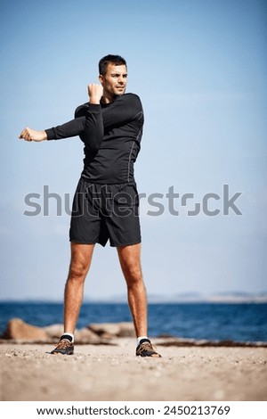 Man, stretch and beach for exercise with fitness in dynamic pose for health with workout in preparation for running. Male person, outdoors and healthy for performance with warm up for body care