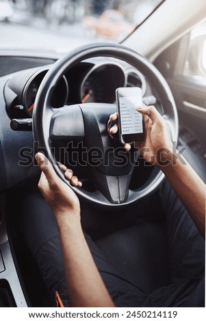 Danger, texting and driving with hands of person on steering wheel with scroll, phone and risk. Road safety, awareness and driver in car with smartphone, distraction and attention with auto insurance Royalty-Free Stock Photo #2450214119