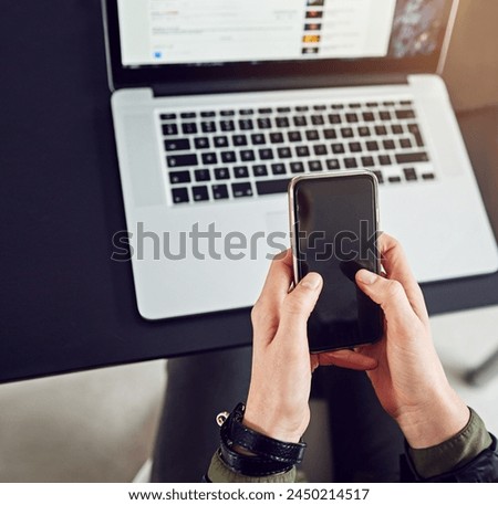 Cellphone, hands and technology in workplace for communication, social median and networking. Laptop, email and marketing for startup company, business influencer and internet for live streaming Royalty-Free Stock Photo #2450214517