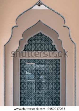 Interior diminishing perspective view with gable partitions wall inside Bang O mosque leading into glass wall. Mosque architecture and art concept, Space for text, Selective focus. Royalty-Free Stock Photo #2450217085