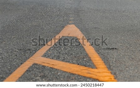An area where drivers of all types of vehicles are prohibited. Which prohibits drivers from entering the Painted Medians area. Paint yellow on the road. Royalty-Free Stock Photo #2450218447