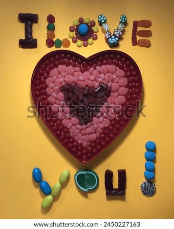 Photo of a message saying "I LOVE YOU!", written with a variety of delicious colorful candies.  