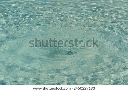 Colorless pool water with water pressure from the bottom and visible on the surface Royalty-Free Stock Photo #2450229193