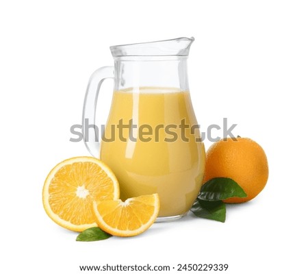 Refreshing orange juice in jug, leaves and fruits isolated on white