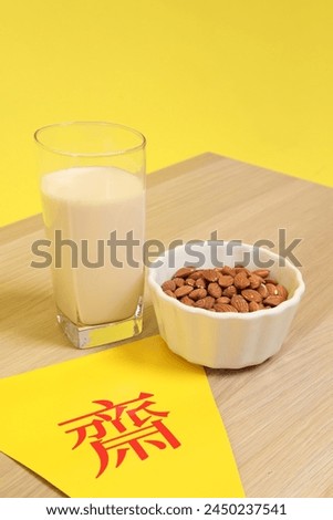 Vegetarian festival triangle flag with almond and Glass of soybean milk, Translation for Chinese and Thai letter is stand for symbol text of vegetarian festival or the meaning of refrain eating meat. 