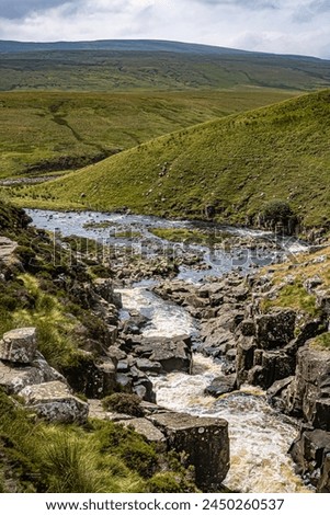 A view down onto the River Tees alongside Cauldron Snout Waterfall Royalty-Free Stock Photo #2450260537