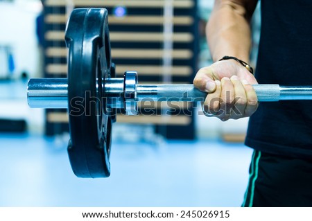 Man with training equipment on sport gym Royalty-Free Stock Photo #245026915