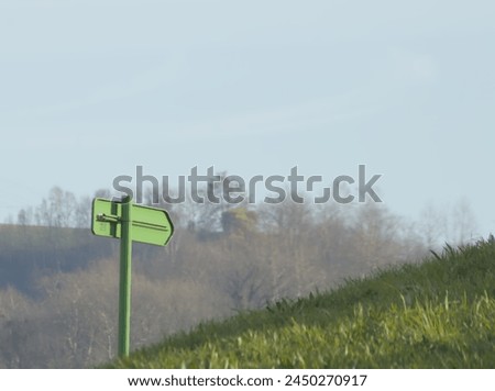 direction sign in the mountain that indicates the path or route to follow for travelers