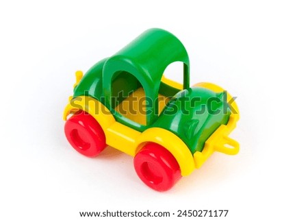 Children's toy multi-colored plastic truck on a white background