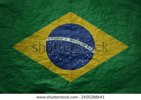 colorful big national flag of brazil on a grunge old paper texture background