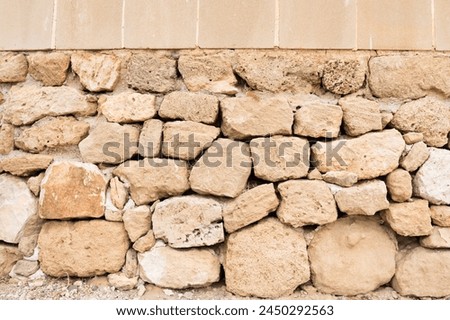 Gray and beige stone wall background