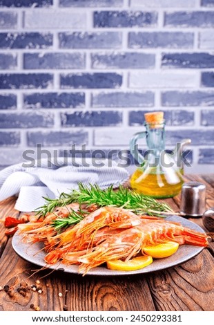 boiled shrimps with fresh lemon and dill on plate