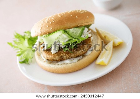 Homemade fish burger with aioli sauce