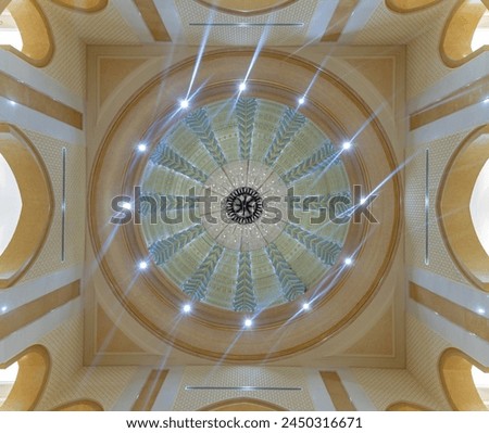 A picture of a chandelier in the ceiling of Qasr Al Watan.