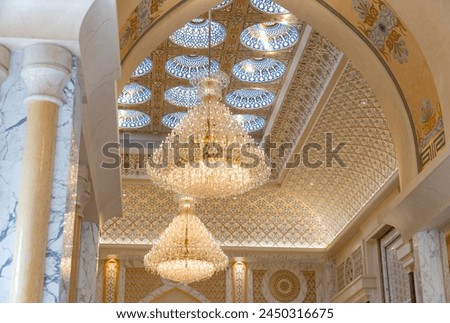 A picture of chandeliers in the ceiling of Qasr Al Watan.