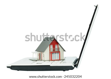 house on computertastaur, symbolic photo for real estate and housing market in the internet