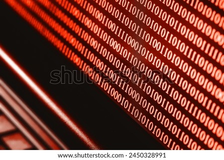 Binary code on computer screen. Hacker background. Red alert background. Internet search.