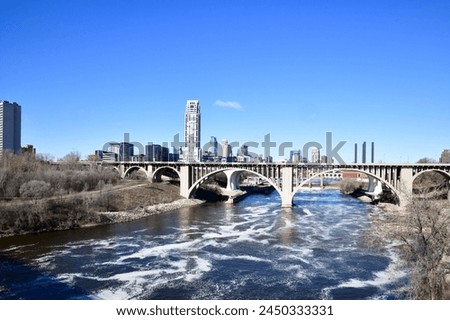 Minneapolis Stone Arch Bridge and City Skyline