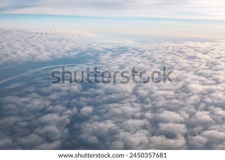 Aerial view of clouds over the Earth. Flying through the clouds in the morning 