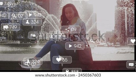 Image of social media icons and business data over biracial woman using smartphone. Global social media, business, connections and data processing concept digitally generated image.