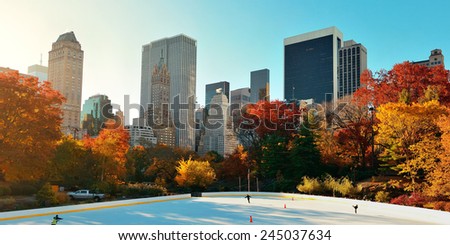 Central Park Autumn ice rink midtown skyline in Manhattan New York City