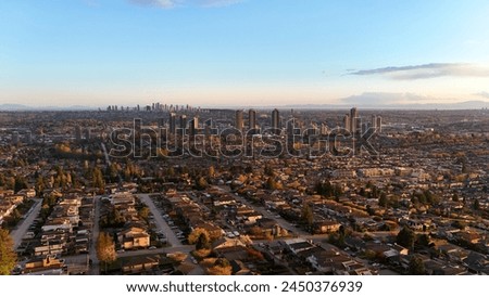 Beautiful sunset over the skyline of Burnaby in the Lower Mainland during a spring season in British Columbia, Canada Royalty-Free Stock Photo #2450376939