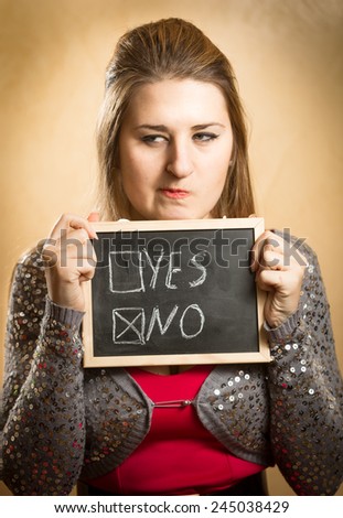 Closeup portrait of woman choosing negative answer box