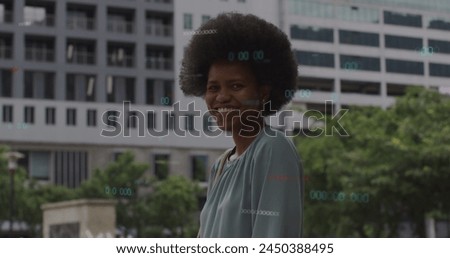 Image of statistics and business data over african american woman in city. Global business, connections and data processing concept digitally generated image.