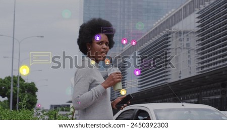 Image of icons and business data over african american woman in city. Global business, connections and data processing concept digitally generated image.