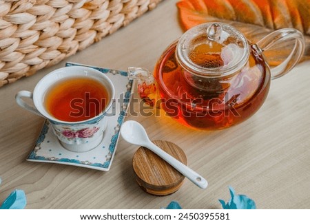 Enjoying a cup of warm tea with a pinch of honey on a sunny afternoon is an irreplaceable pleasure. Royalty-Free Stock Photo #2450395581