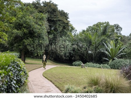 a girl walking in forest path
