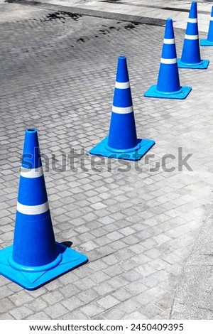 Road cones mark the path. Traffic management