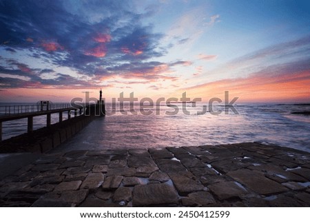Amble Harbour Light and Coquet Island at dawn, Northumberland, England, United Kingdom, Europe Royalty-Free Stock Photo #2450412599