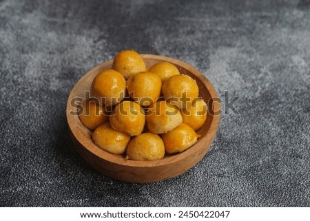 Nastar Cookies, Pineapple tarts or nanas tart are small, bite-size pastries filled or topped with pineapple jam, commonly found when Hari Raya or Eid Al Fitr or Lebaran. Selective focus. Royalty-Free Stock Photo #2450422047