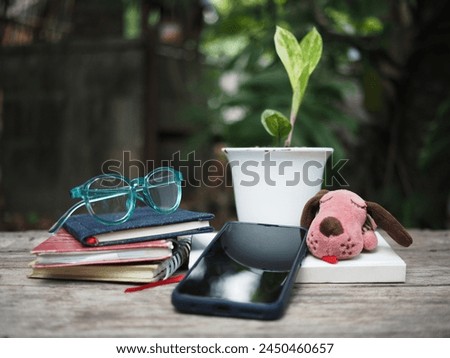 work space in garden green garden background relax and tecnology mobile