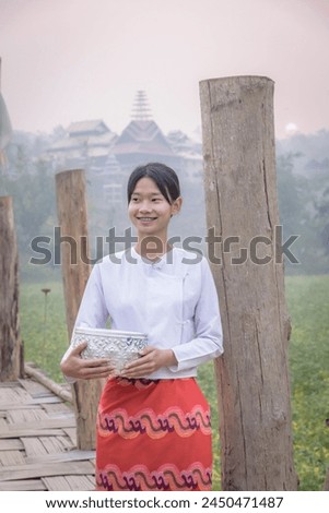 Dressing of young women in Tai Yai clothing At Mae Hong Son beautiful clothes Take a walk and admire the view on the bridge and rice fields.