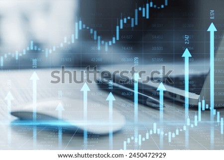 Close up of laptop, mouse and supplies at desk with growing blue vertical arrows and candlestick forex chart on blurry index grid background. Economic growth and increase concept. Double exposure