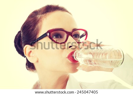 Beautiful business woman drinking water.