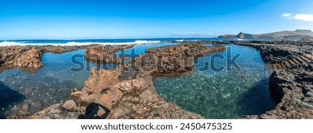 Panoramic view of the Las Salinas de Agaete natural pools in Puerto de Las Nieves in Gran Canaria, Spain. Royalty-Free Stock Photo #2450475325