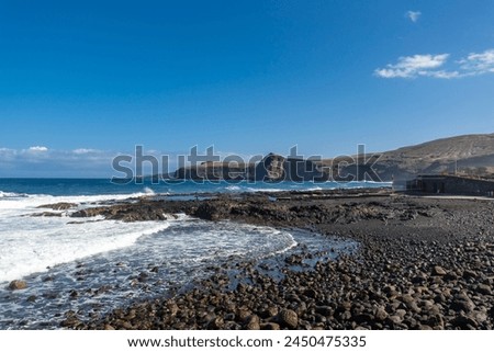 Beach near the Las Salinas de Agaete natural pools in Puerto de Las Nieves in Gran Canaria, Spain. Royalty-Free Stock Photo #2450475335