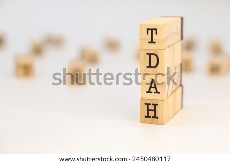 abbreviation for attention deficit hyperactivity disorder in Spanish TDAH letters isolated on white background. Royalty-Free Stock Photo #2450480117
