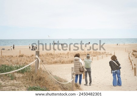 Tourists taking pictures of mediterranean coast in Spain