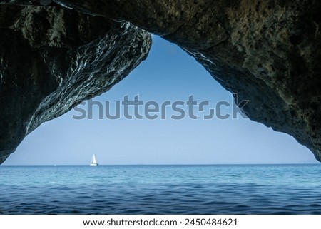 Tiny,pebble beach overlooking the sea on the Greek island of Cephalonia. Royalty-Free Stock Photo #2450484621