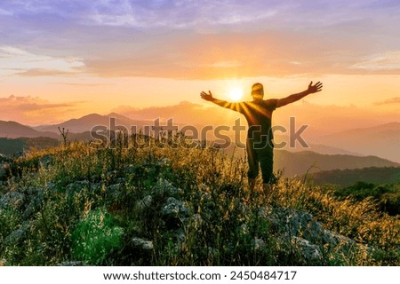 man doing hiking sport in mountains with anazing highland view, sportsman person does hike sport in a mountain walley with beautiful sunset on background
