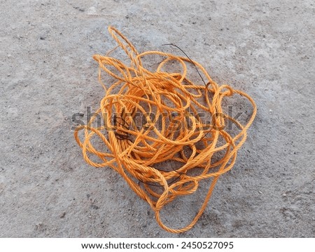 Photo of plastic rope on a cast floor. The picture was taken in Kuala Kubu, Malaysia