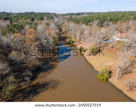 Aerial landscape of trees and a pond in rural edge of southern Augusta Georgia USA