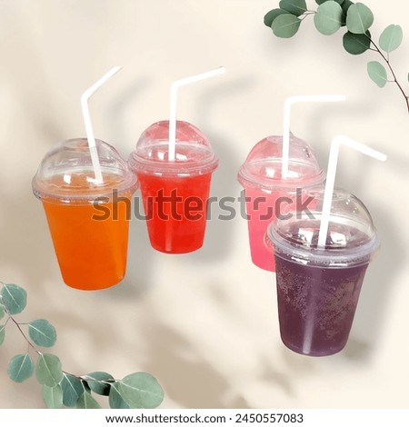 These drinks are a burst of colors! Each cup seems to hold a different flavor. The straws add a fun touch. It must be a delightful treat for the taste buds! Enjoy sipping on those vibrant beverages!