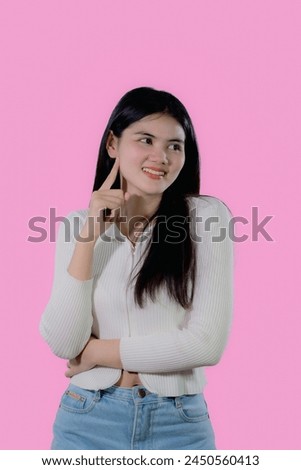 asian woman in color casual dress thinking and imagination isolated on pink background.Asian cute people looking copy space for text advertise.